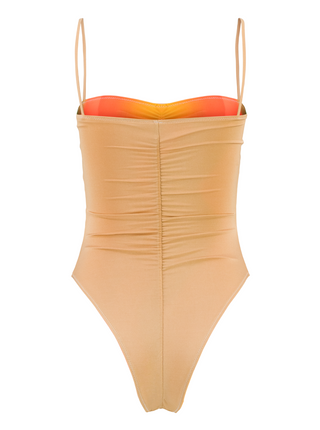 Our reversible one-piece swimsuit, designed to fit like a second skin, features a front opening and elastic at the back for a secure and sophisticated silhouette. Its cheeky cutouts creates a leg-lengthening effect both in the front and back. Maureen is wearing a size S.